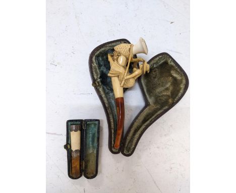 A Meerschaum pipe fashioned as a woman and snake, a cigarette holder, a silver parasol handle fashioned as a duck and another
