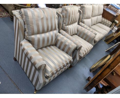 A Duresta three seater sofa 88cm h x 190cm w, together with a pair of matching armchairs, 88cm h x 85cm wLocation: 