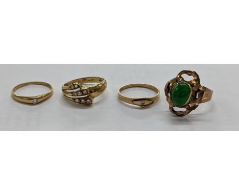 A 14k gold ring set with three lines of white stones, gold rings each set with a single white stone one stamped 14k and a ros