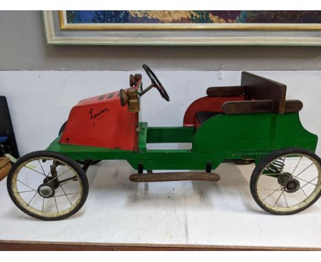 A child's vintage scratch built peddle car with spoked wheelsLocation: G 
