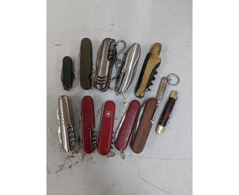 Twelve Swiss army style penknives to include a Swiss army penknife, boyztoys and othersLocation: 