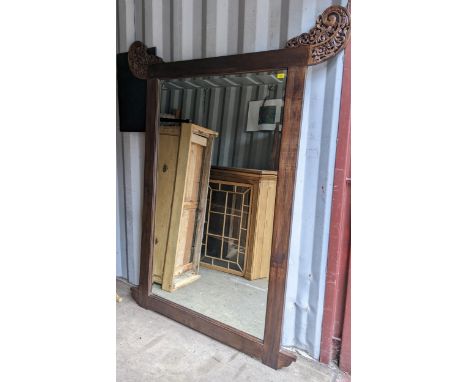 A large Chinese mirror having carved floral and scroll finials, 199cm h x 159cm wLocation: 
