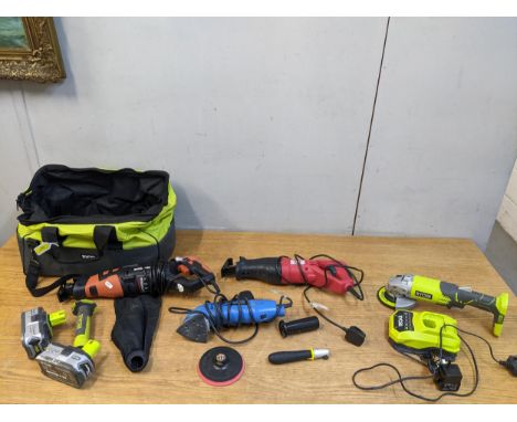A group of power tools to include a Ryobi 18-volt angle grinder with accessories, in a bag, an Evolution multi material cutti