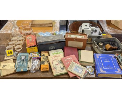 A mixed lot to include glassware, books to include The 1957 Gadgets and others, an AA badge, Motor Fuel Ration book, vest poc