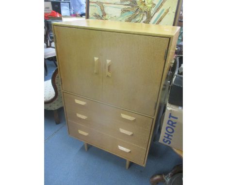 A mid 20th century Stag 'Concorde' light oak cabinet having two doors above three drawers, 119cm h x 75.5cm wLocation: 