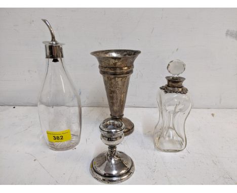 A group of silver and glass items to include  silver weighted vase, dwarf candlesticks, a Mappin &amp; Webb glass bitters bot