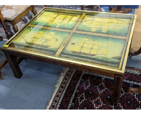 A vintage coffee table having a painted top depicting sailing ships 44.5cm h x 111cm w Location: 