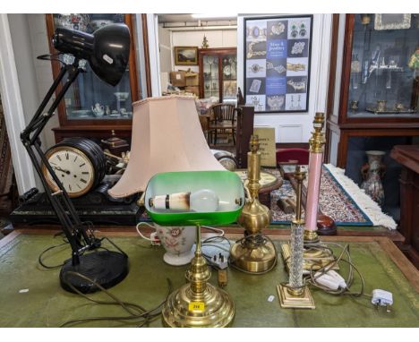 A selection of table lamps to include a brass effect Banker's lamp with green glass shade, a black coloured anglepoise lamp, 