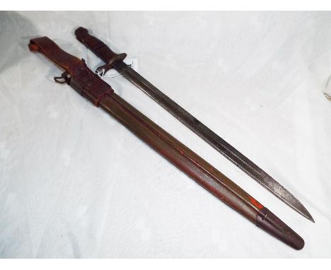 A USA World War One (WWI) bayonet marked 1917 Remington with hard case scabbard Est £80 - £100