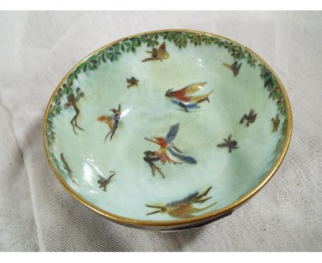 A Wedgwood Fairyland lustre ware pedestal bowl decorated with depictions of fairies and similar 7 cm (h) x 13.7 cm (d) estima