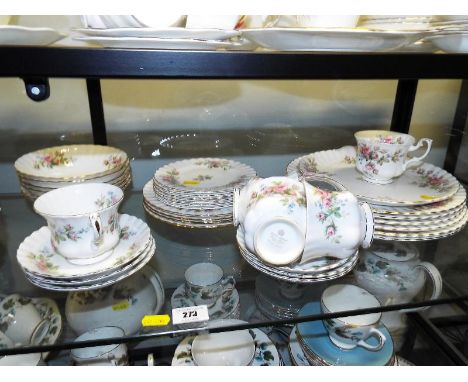 A quantity of ceramic tableware by Royal Albert in the Moss Rose pattern comprising approximately 35 pieces and pictorial pla