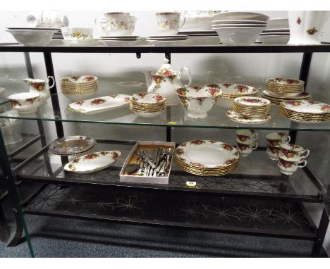 A Royal Albert tea and dinner service decorated in the Old Country Roses pattern comprising approximately 60 pieces, 6 place 