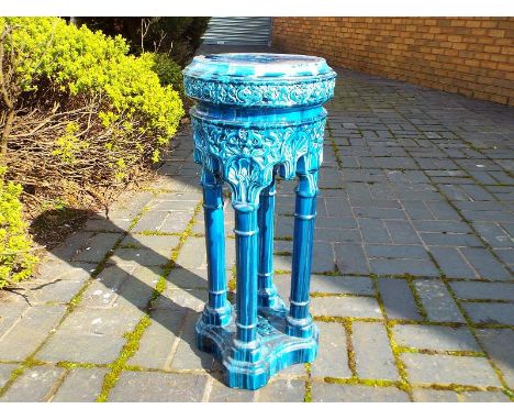 A ceramic planter 69cm (h) x 29 cm (d)