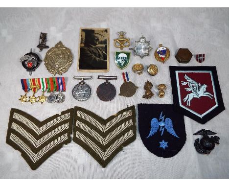 A mixed lot to include Militaria patch badges, tunic buttons, cap badges, First Argyle Highland Rifle Volunteers and other, W