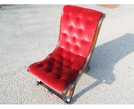 A cherry red button back chair