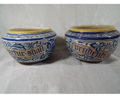 Two Victorian bowls decorated in shades of blue and orange, of which one marked with the legend 'animum prudentia firmat', th