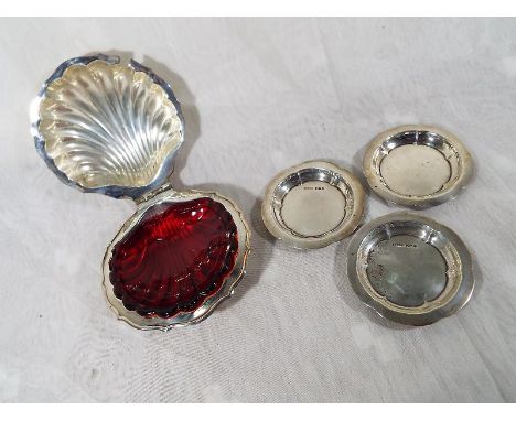 Three George VI silver trinket dishes, Sheffield assay 1946 / 48 and a plated shell dish with red glass inner (4)