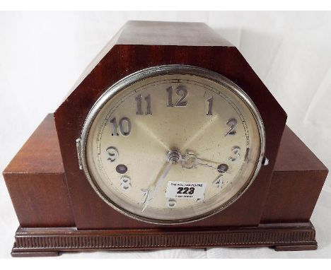 A mahogany cased Art deco styled Westminster chiming mantle clock, silvered dial with applied, chrome, polished Arabic numera