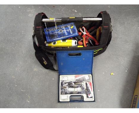 A Stanley Fatmax tool bag containing a variety of tools to include  a large amount of screwdrivers, a dye set and a staple gu