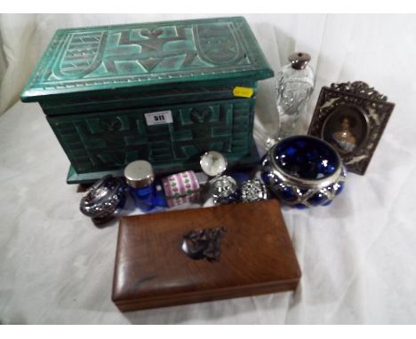 A wooden box containing a good mixed lot of collectables to include a Ronson Crown table lighter, enamelled egg which contain