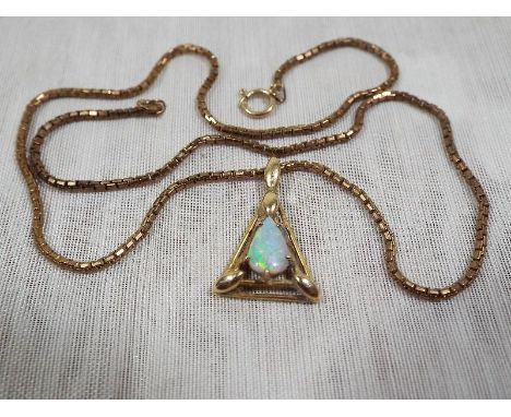 A lady's 9ct gold necklace and pendant set with single opal stone, approx weight 6.5 grams Est £50 - £80