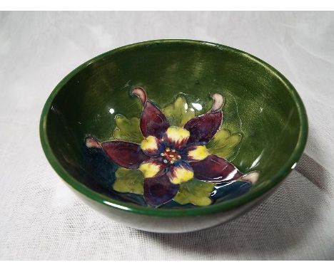 A Moorcroft Pottery small pedestal bowl decorated with lily on a green ground, 5.5cm (h) x 11cm (diam) - Est £50 - £80