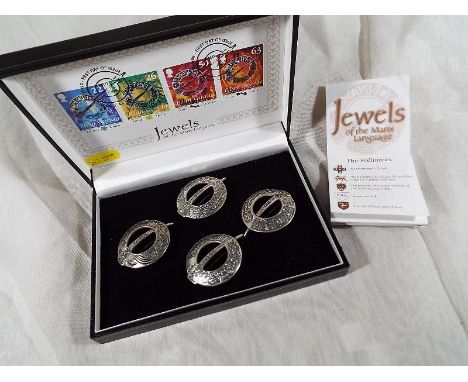 A cased set of the Jewels of the Manx Language comprising 4 hallmarked silver brooches with explanatory leaflet