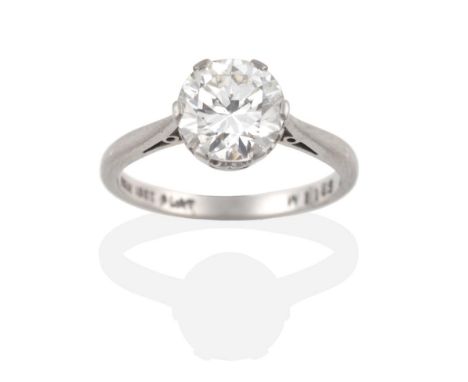 A Solitaire Diamond Ring, a round brilliant cut diamond in a claw setting, to knife edge shoulders, estimated diamond weight 