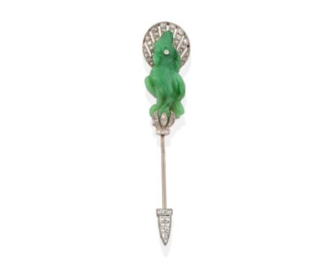 A French Art Deco Jade and Diamond Cockatoo Jabot Pin, a carved jade cockatoo with a diamond set eye and within a pierced gra