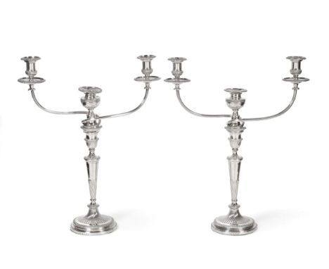 A Pair of George III Silver Candlesticks, Nathaniel Smith &amp; Co, Sheffield 1800, with urn shaped nozzles and tapering stem