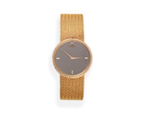 An 18ct Gold Diamond Set Wristwatch, signed Omega, circa 1980, quartz movement, silvered dial with quarter section baton mark