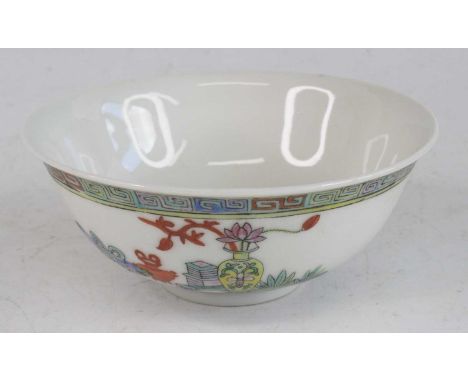 A Chinese Guangxu period (1871-1908) porcelain footed bowl, enamel decorated with Greek Key upper border, the body with vases