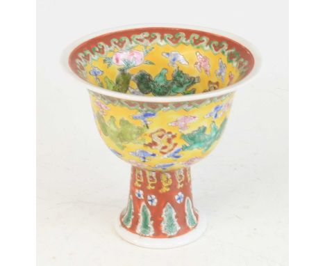 A Chinese famille jaune and famille rouge stoneware stem cup, all-over enamel decorated with mythical creatures and foliage, 