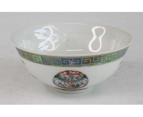 A Chinese Guangxu period (1871-1908) porcelain footed bowl, enamel decorated with Greek Key upper border, the body with mythi