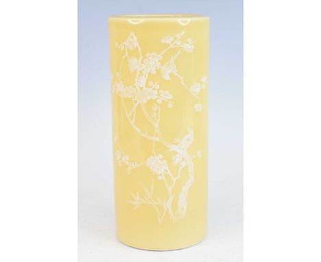 A large Chinese Jiaqing period (1796-1820) yellow ground stoneware vase, of cylindrical form, the body white enamel decorated