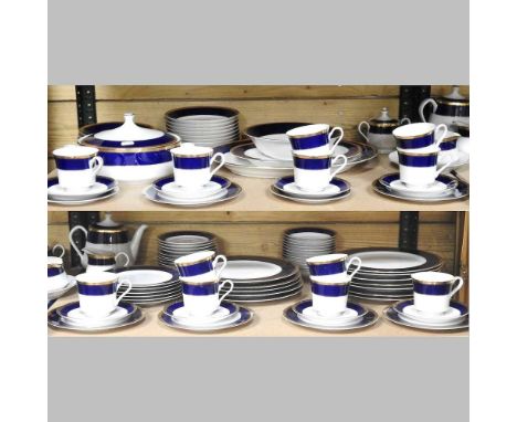An extensive Japanese porcelain tea and dinner service, with blue and gilt borders, approximately sixty pieces