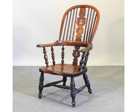 A 19th century elm seated windsor chair, on turned legs