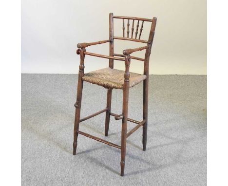 An early 20th century child's spindle back high chair