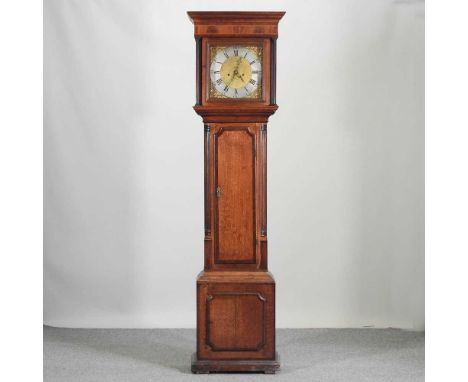 An 18th century oak and mahogany crossbanded cased longcase clock, the brass twelve inch dial signed Thos Ore, Tong, with an 