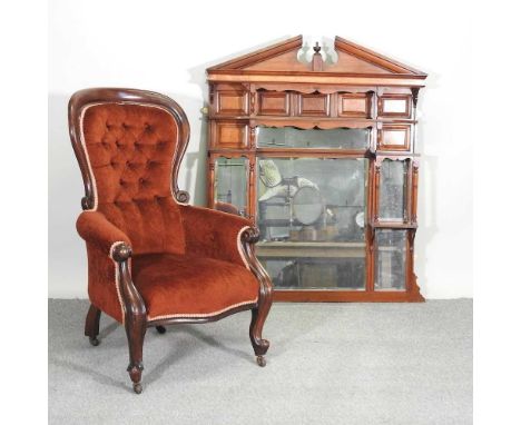 An Edwardian walnut over mantel mirror, together with a Victorian red upholstered button back armchair (2)