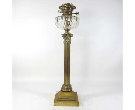An 19th century brass Hinks patent Corinthian column oil lamp, with a cut glass reservoir, numbered 1782, 66cm high