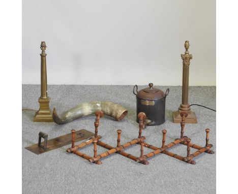 A brass corinthian column table lamp, 57cm high, together with another, a cow horn, a coat rack, an urn and a letter box faci