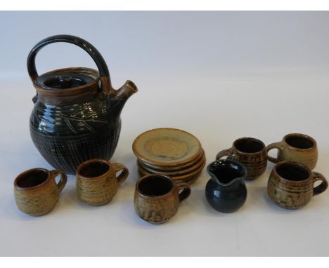 Devon Studio Pottery - A Teapot and Milk Jug Marked ‘TP’, in Green together with 6x Coffee Cups and Saucers in Brown by Roger