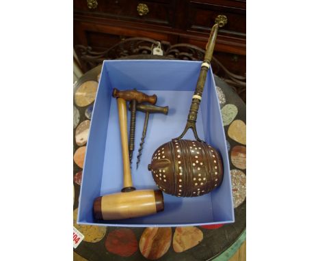 An unusual wooden and horn ladle, having bone inlay; together with a wooden gavel; and two old corkscrews.&nbsp; 
