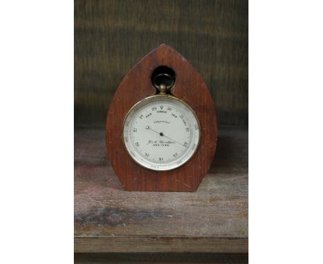 A vintage portable barometer, by 'G A Boettger, Cape Town',&nbsp;7cm wide, in later wooden stand. 