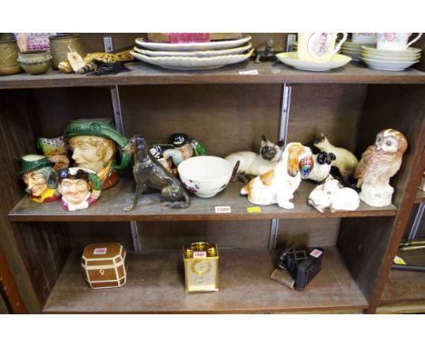 A vintage Rosenthal porcelain seated 'Chocolate Labrador', number 1216; together with six Royal Doulton character jugs; four 