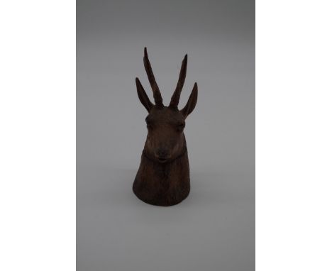 A Black Forest&nbsp;novelty&nbsp;carved wood deer's head inkwell, 16cm high, (s.d.). 