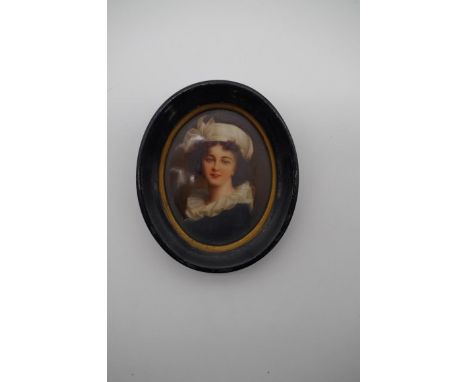 A 19th century oval portrait miniature of a young lady, painted on porcelain, 8cm high. 