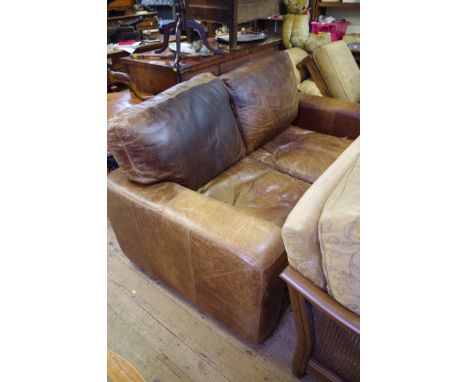 A brown leather two seat sofa, 175cm wide.&nbsp; 