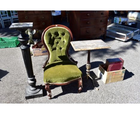 A sundry lot of furniture, comprising: a Victorian green button upholstered nursing chair; an ebonized torchere; and ebonized